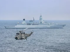 Westland WS-61 Sea King Helicopter Flying From the Deck of the German Frigate Sachsen