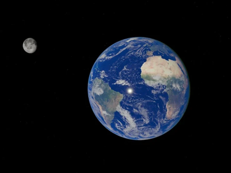 Photograph of Earth and Moon in space against a black background. Earth appears as a large, bright blue sphere with white cloud formations, visible landmasses including Africa and South America, and deep blue oceans. The Moon appears smaller to the left of Earth, showing its grey, cratered surface fully illuminated. Both celestial bodies are shown in high detail with realistic proportions and spacing.